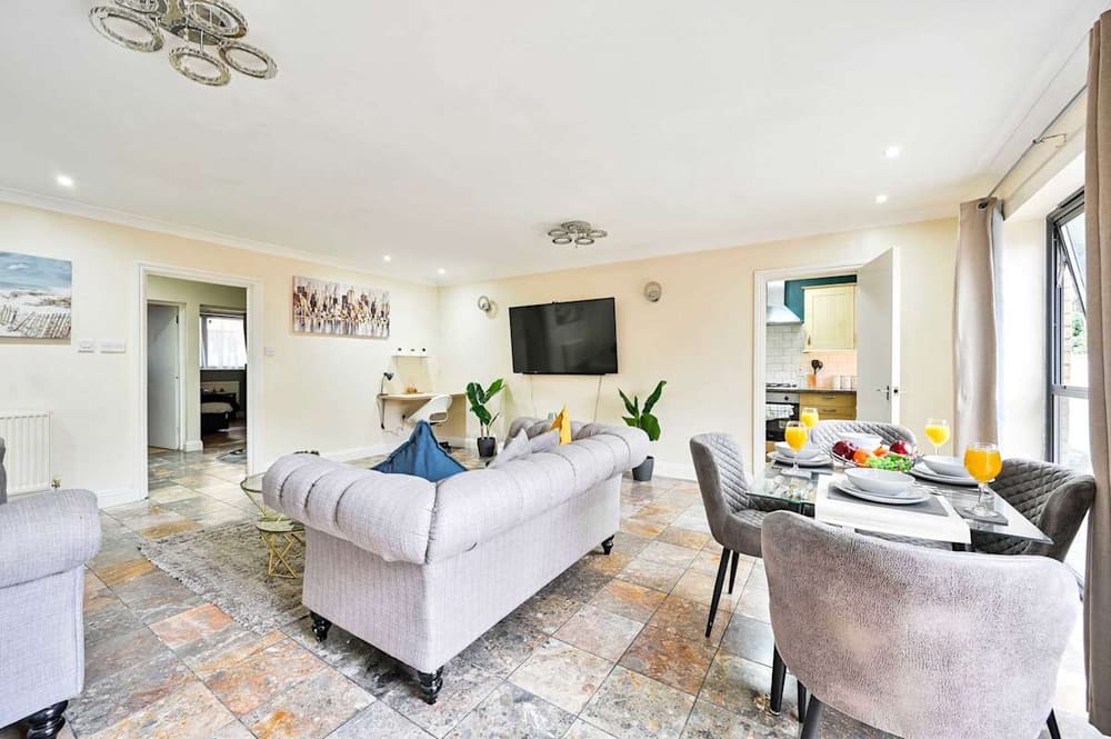 Open-plan living and dining room in our Stratford apartment